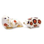 Two Royal Crown Derby porcelain paperweights, comprising Seal, gold stopper, 12cm high, and Pig, sec