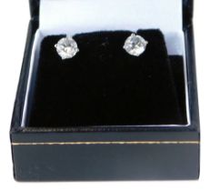 A set of 18ct white gold diamond stud earrings, each with round brilliant cut diamond, in a four cla
