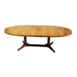 Withdrawn pre-sale by vendor - A 1970s rosewood oval dining table, with extending action and additio