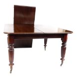 A Victorian mahogany extending dining table, the top with a moulded edge, raised on four fluted tape