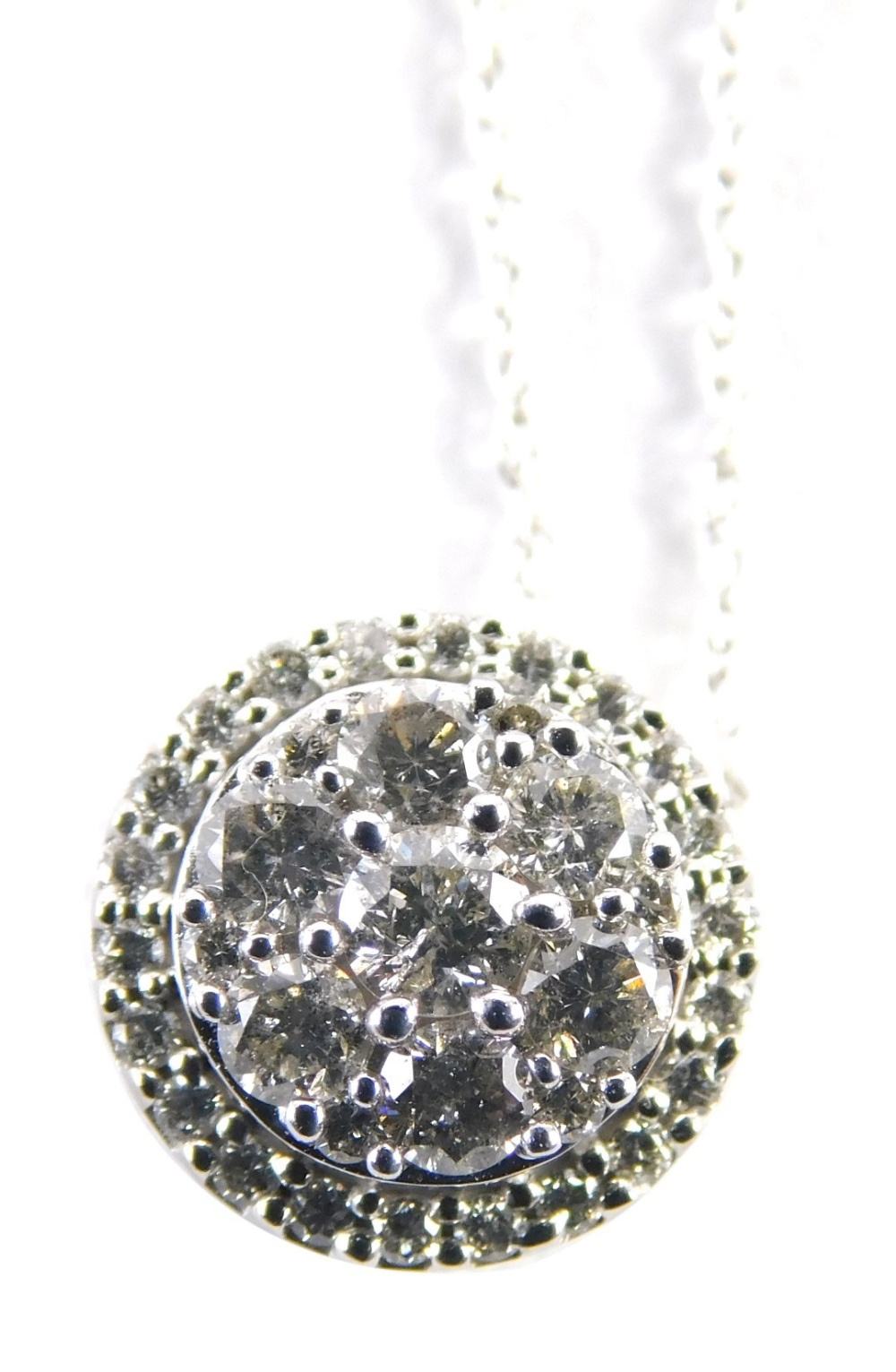 A 9ct white gold diamond cluster necklace, with small circular pendant set with an arrangement of r