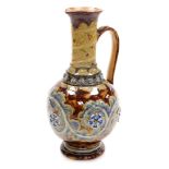 A late 19thC Doulton Lambeth stoneware jug, dated 1874, of baluster form, decorated with bands of sc