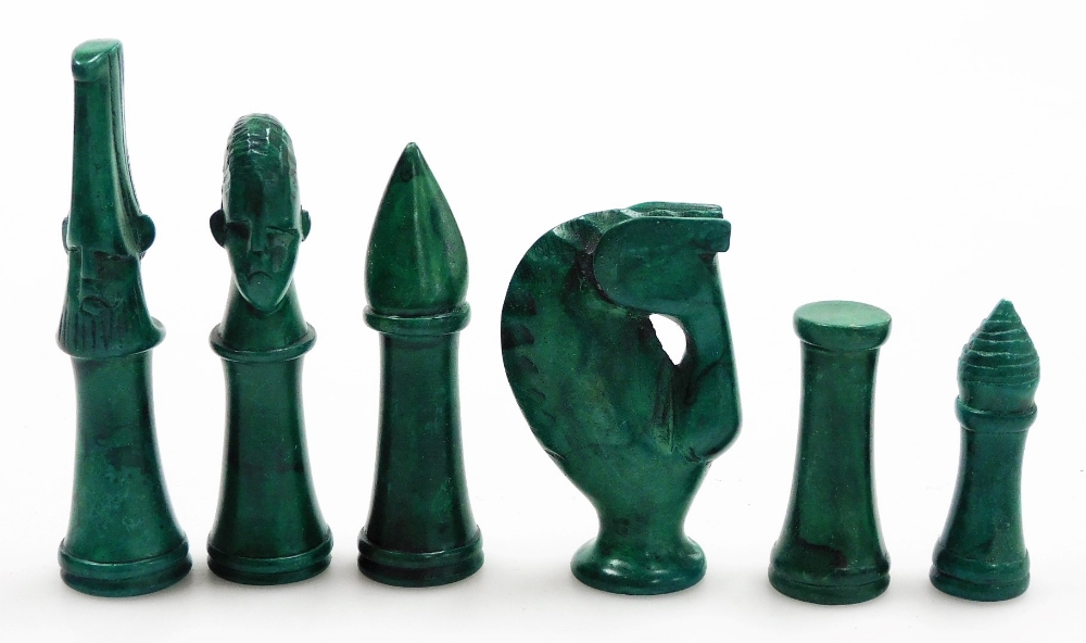 An African hardstone chess set, with black and green pieces, on a circular chess board, decorated to - Image 2 of 5