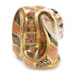 A Royal Crown Derby porcelain Snake paperweight, red printed marks and gold stopper, 8cm high, boxed