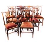 A set of nine Chippendale style mahogany dining chairs, each with a pierced splat, drop in seat, com