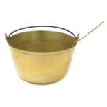 A brass jam pan, with a cast iron handle, 13.5cm wide, together with a brass ladle.