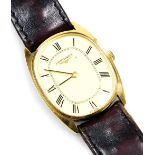 A Longines gold plated gentleman's wristwatch, oval champagne dial bearing Roman numerals, case back