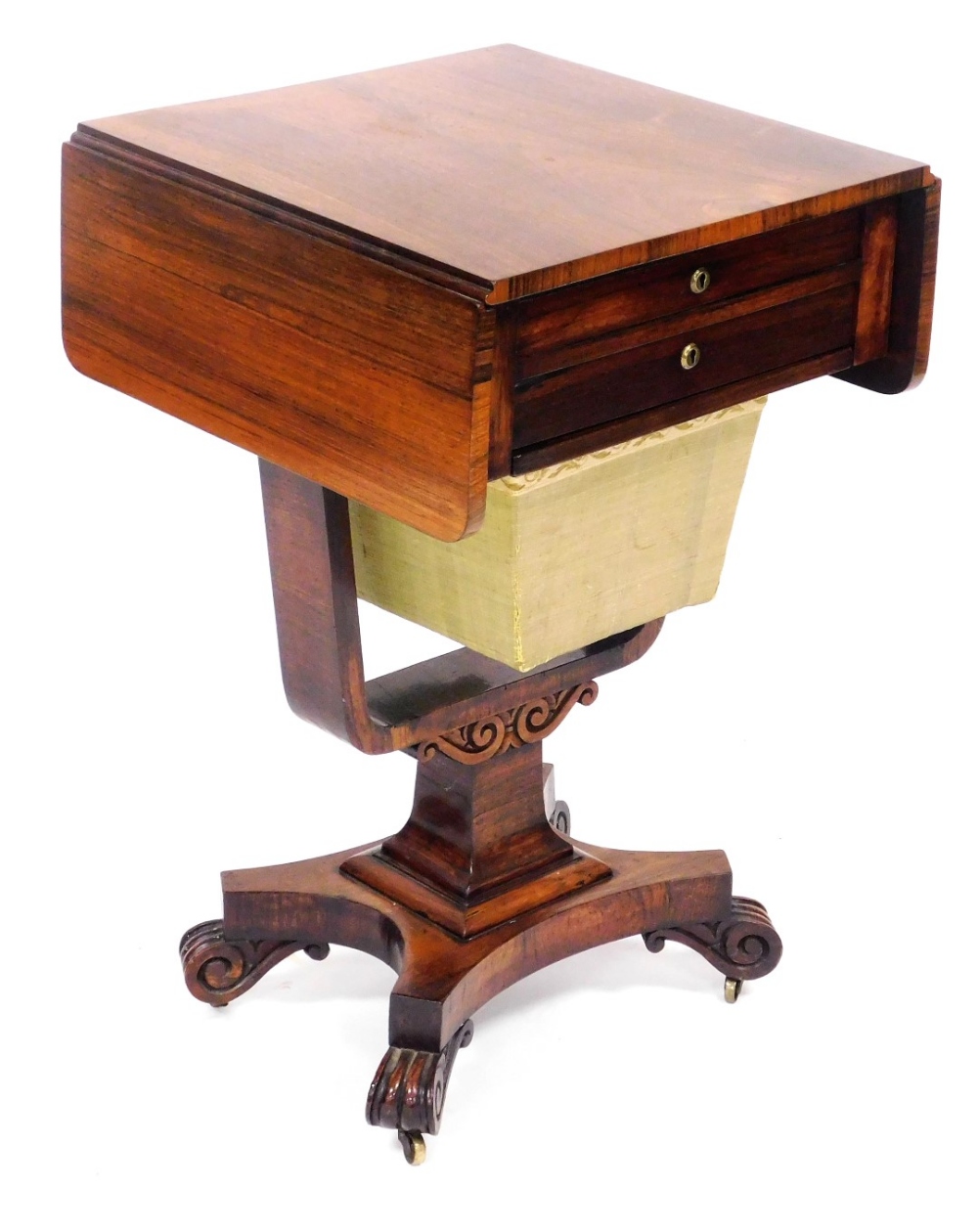 A William IV rosewood lady's work table, with a drop leaf top over two frieze drawers, with bucket b