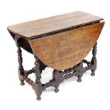 An 18thC oak gate leg table, the oval top on part turned supports, with pad feet, 73cm high, 102cm w