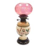 A late 19thC Benetfink & Company Hink's 2 duplex pottery oil lamp, decorated with butterflies and ap