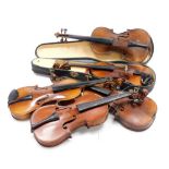 Five various violins, one cased, including student examples.