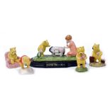 A Royal Doulton Winnie the Pooh Collection figure group, modelled as Eeyore Loses a Tail, limited ed
