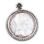 A Maria Theresa silver thaler 1780, in a white metal pendant mount.