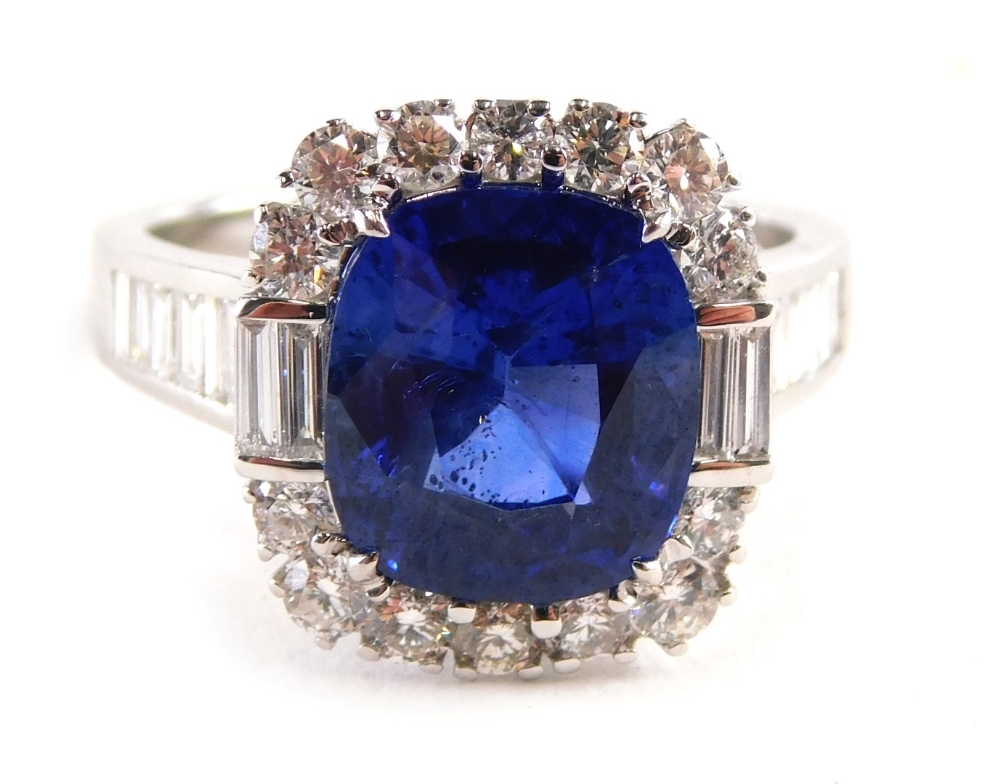 An 18ct white gold sapphire and diamond dress ring, with a central large rectangular cushion cut sap