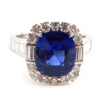 An 18ct white gold sapphire and diamond dress ring, with a central large rectangular cushion cut sap