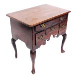 An 18thC oak low boy, with one shallow drawer and three further drawers below with shaped apron, on