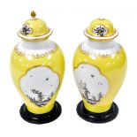 A pair of 20thC Meissen porcelain vases and covers, manner of Johann Horoldt, decorated with reserve