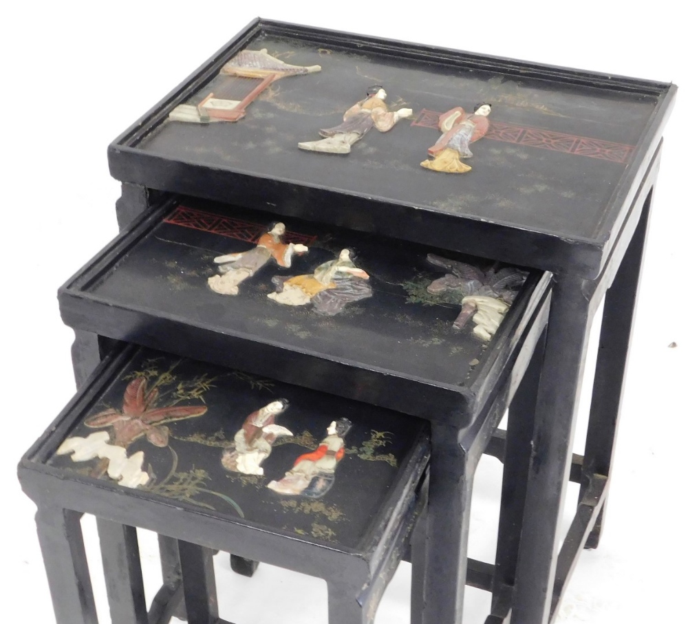 A Chinese black lacquered and hardstone inlaid nest of occasional tables, each glazed top decorated - Image 2 of 2