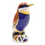 A Royal Crown Derby porcelain Bee Eater paperweight, red printed marks and gold stopper, 10cm high,