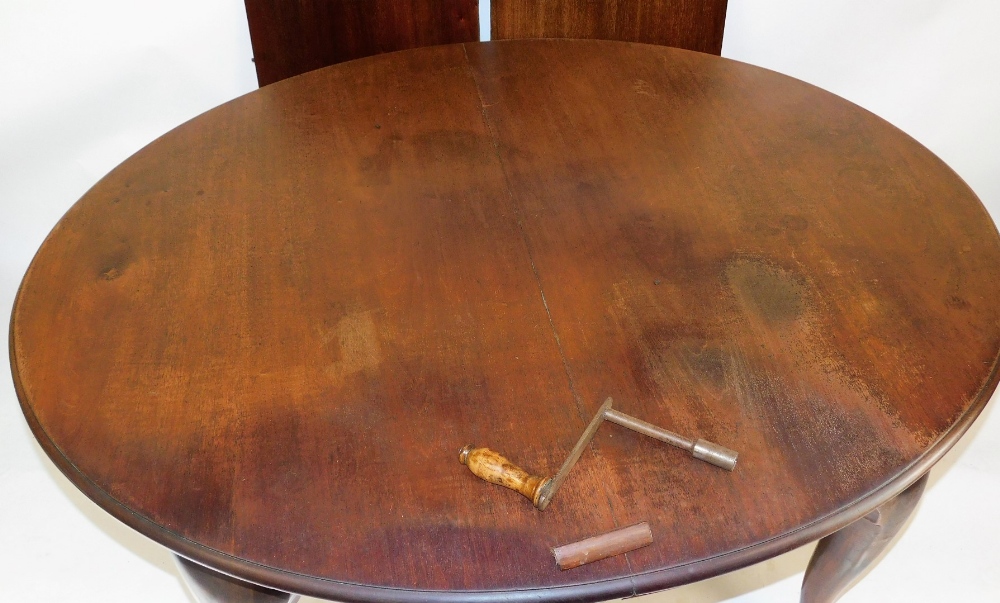 A Victorian mahogany extending dining table, the oval moulded top raised on four ball and claw feet, - Image 2 of 2