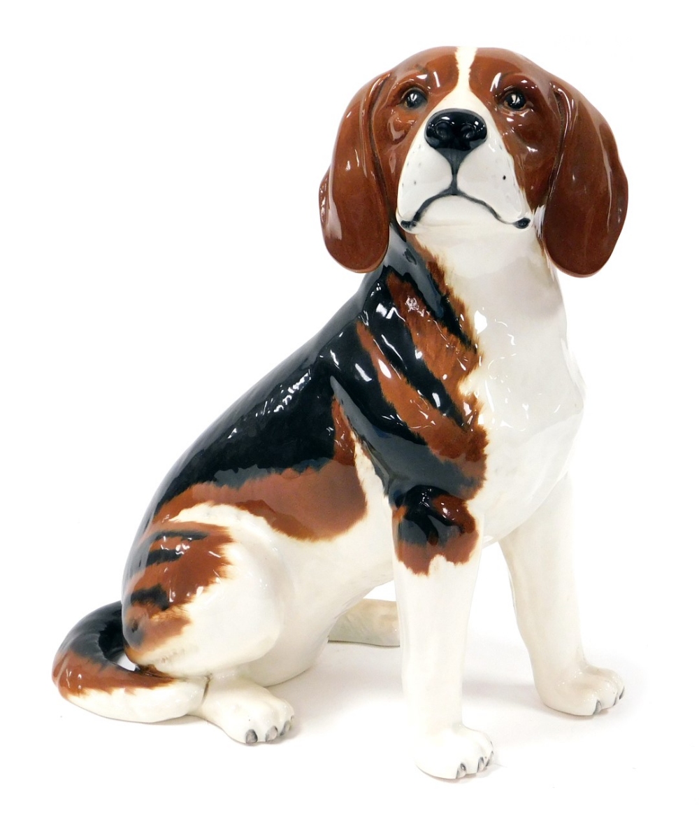 A Beswick pottery fireside dog modelled as a Beagle, number 2300, impressed marks.