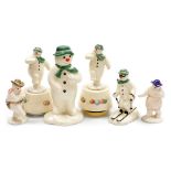 A group of Royal Doulton The Snowman figures, comprising a pair of The Snowman gift collection music