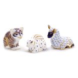 Three Royal Crown Derby porcelain paperweights, comprising Lamb, red printed marks and silver stoppe