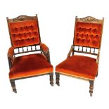 An Edwardian gentleman's open armchair, with carved crest rail and button upholstered back and over