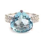 An 18ct white gold aquamarine and diamond ring, the mixed pear cut aquamarine totalling approx. 4.3