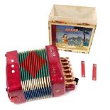 A Hero child's accordion, made in Shanghai, China, boxed but lacking lid.
