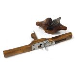 A vintage wooden and cast iron rounding plane, stamped WS, 19cm wide, together with an oak router pl
