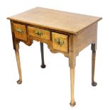 A late 18th/early 19thC oak lowboy, the rectangular top with a moulded edge above three drawers, and