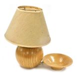 A late 20thC Continental banded wooden table lamp, of globular form, with an oatmeal coloured shade,