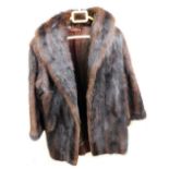 A lady's mink three quarter length coat, underarm measurement approx 43cm.