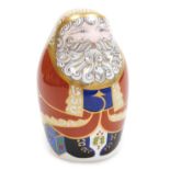 A Royal Crown Derby porcelain Santa paperweight, red printed marks and gold stopper, 11.5cm high.