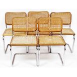 A set of five 1970s chrome framed dining chairs, each with a caned seat and back. (AF)