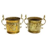 A pair of Middle Eastern brass twin handled jardinieres, embossed with band of Assyrian figures, 25c