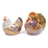 Two Royal Crown Derby porcelain paperweights, comprising Cockerel, second, struck through red printe