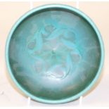 A Pilkingtons Royal Lancastrian pottery bowl, decorated with floral and foliate motifs against a blu