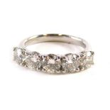 A platinum five stone diamond ring, set with five round brilliant cut diamonds, totalling approx 2.0