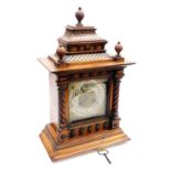 A late 19thC mahogany cased mantel clock, the brass Arabic numeral face with silvered chapter ring,