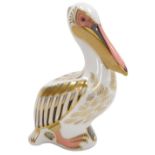 A Royal Crown Derby porcelain White Pelican paperweight, limited edition number 2706/5000, red print