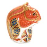 A Royal Crown Derby porcelain Squirrel paperweight, red printed marks and gold stopper, 9cm high, bo