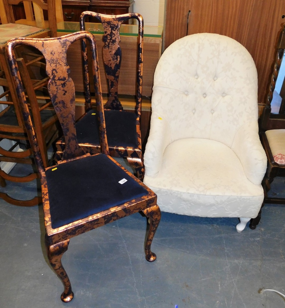 A 20thC spoon back armchair, upholstered in cream floral fabric, together with two painted Queen Ann