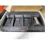 A Leica battery charging unit, boxed. Note: VAT is payable on the hammer price of this lot at 20%.