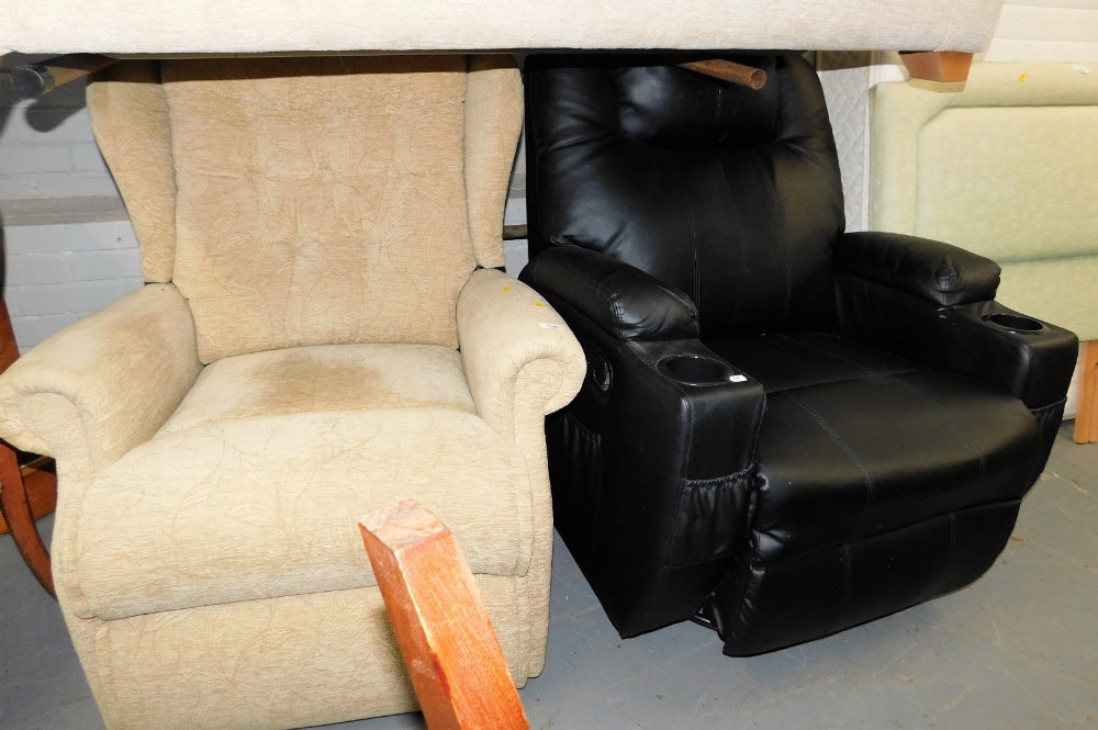 A black leather reclining armchair, together with a further cream upholstered manual recliner armcha