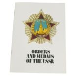 A copy of The Orders and Medals of the USSR, coloured catalogue with forty pages printed in 1944.