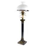 A Victorian silver plated Corinthian column oil lamp, with a clear glass reservoir and white glass s