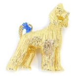 A vintage gilt metal brooch of a long haired poodle, modelled in standing pose, inset glass eyes, 5.