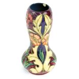 A Moorcroft Pottery vase decorated with flowers, against a cream ground, circa 2000, painted and imp